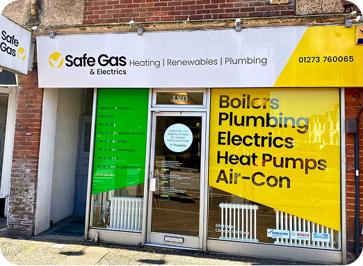 Safe Gas shop front in Hove. Banner in window advertises heating, electrics, boilers, heat pumps, air con, renewable services in Brighton and Hove